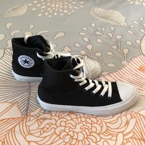 Black high top Chuck Taylor’s